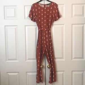 Orange romper from Clad & Cloth
